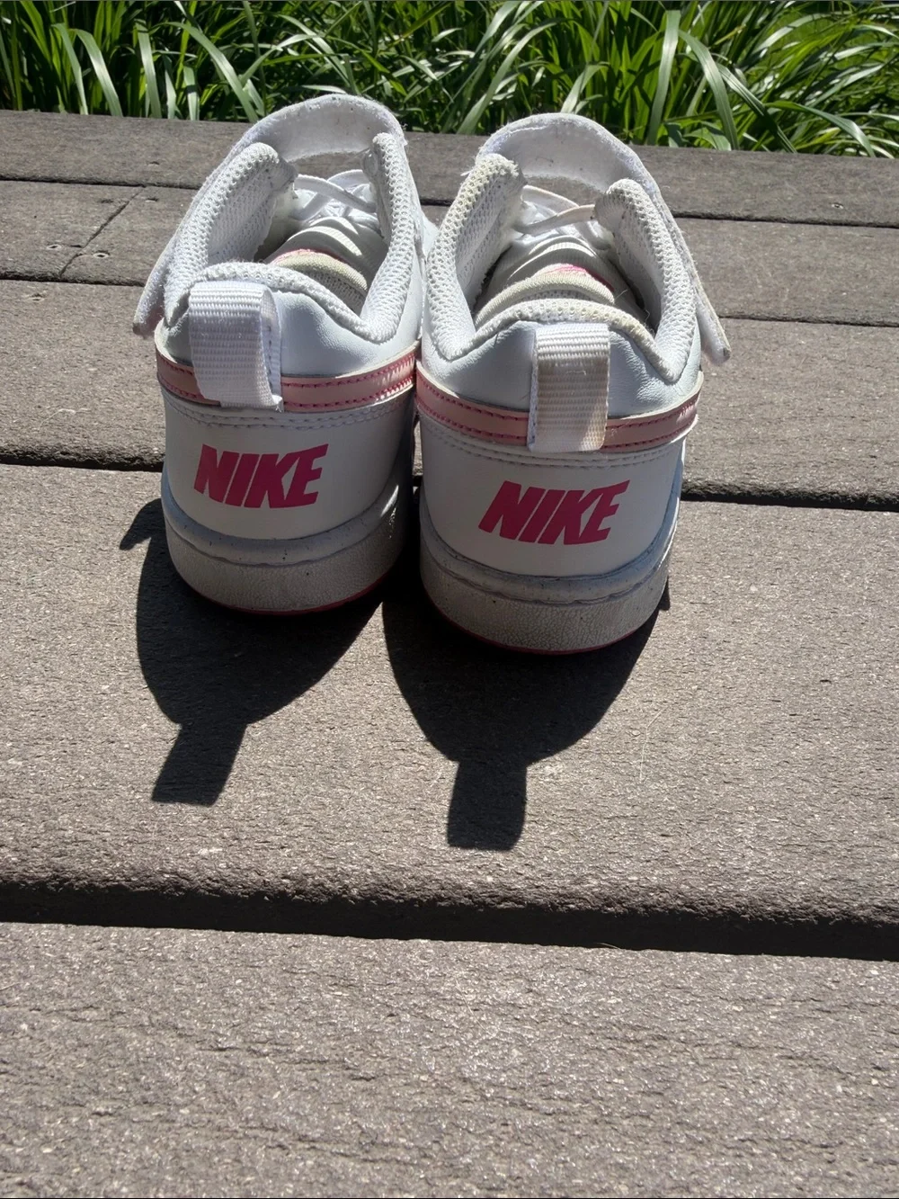 Youth size 1.5 Nike White Sneakers with Pink Swoosh Accent